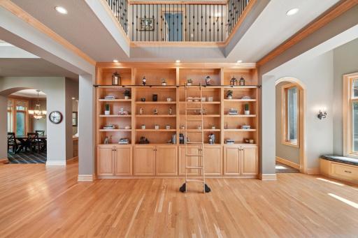 Inside, youâre welcomed by a sweeping grand staircase, a dramatic two-story foyer, and an impressive library