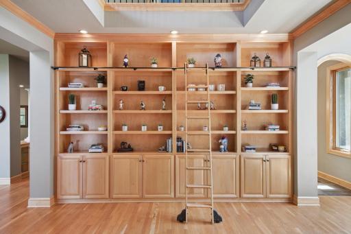 Inside, youâre welcomed by a sweeping grand staircase, a dramatic two-story foyer, and an impressive library