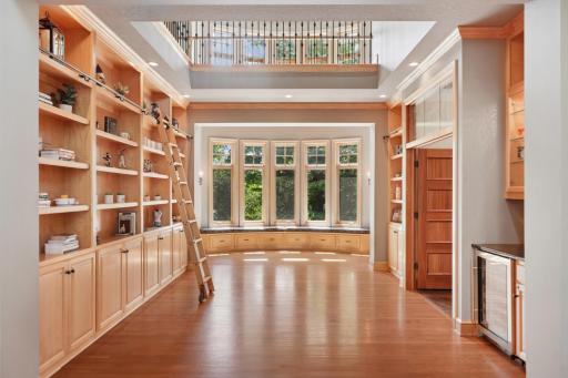 Inside, youâre welcomed by a sweeping grand staircase, a dramatic two-story foyer, and an impressive library