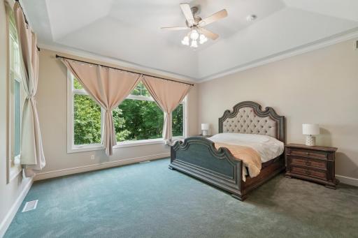 The main-level vaulted ownerâs suite offers a true escape with a two-sided fireplace, jetted tub, heated floors, and dual walk-in closets.