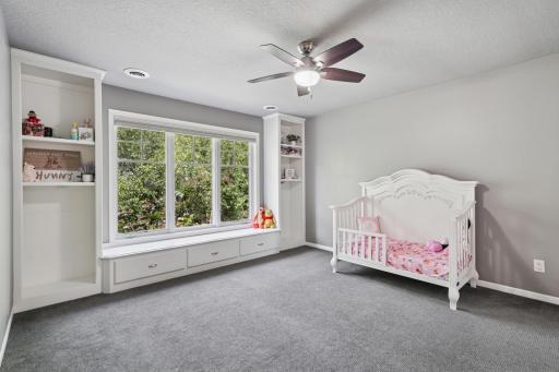 Three upper-level bedrooms, including a Jack & Jill setup and private suite.