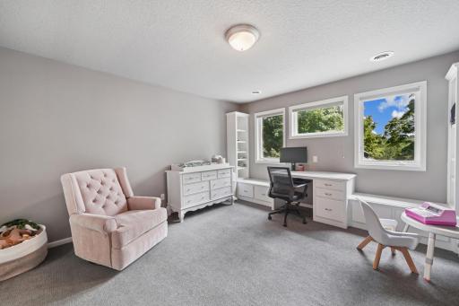 Three upper-level bedrooms, including a Jack & Jill setup and private suite.