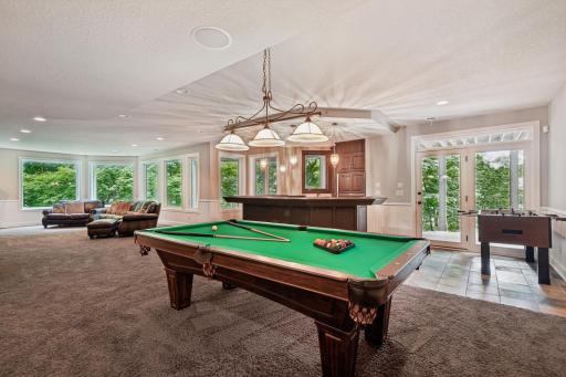 Walkout lower level with custom bar, wine cellar, and theater room.