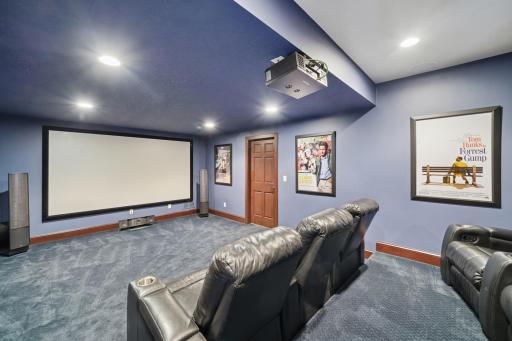 Theater room with tiered seating, ready for your next movie marathon.