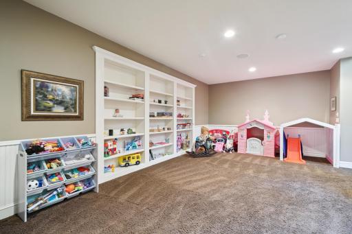 Large lower-level bonus roomâideal for a playroom or game roomâwith a hidden bookshelf door that opens to secret under-stair storage!