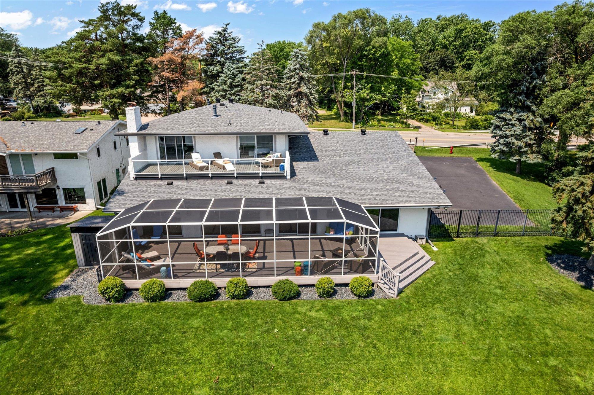 Aerial view shows decks off primary suite.