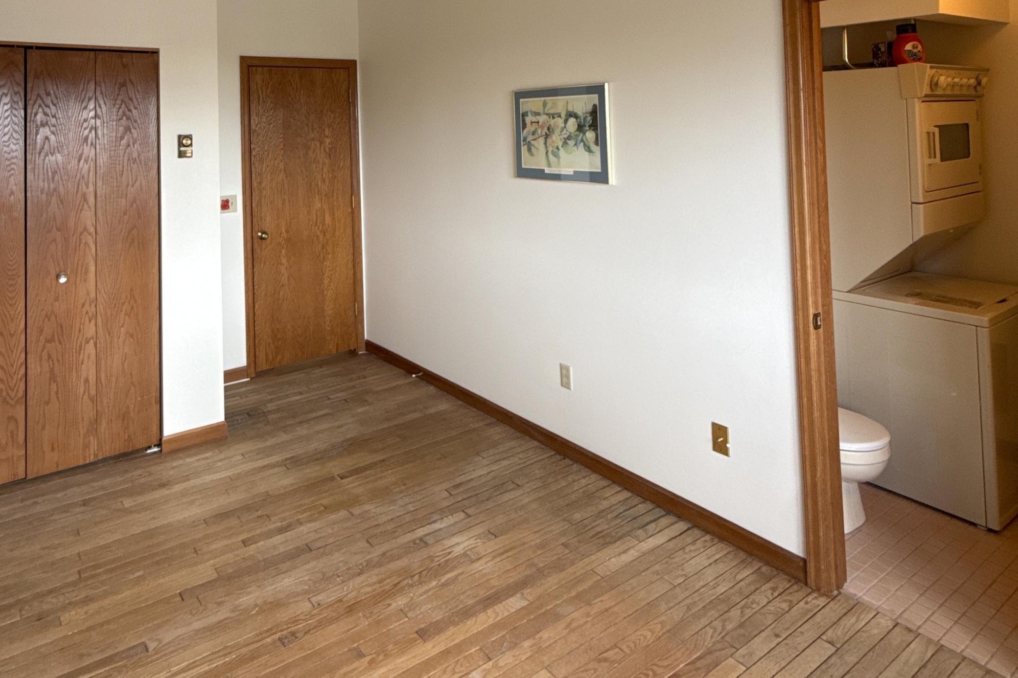 Primary bedroom with three quarter bath and laundry