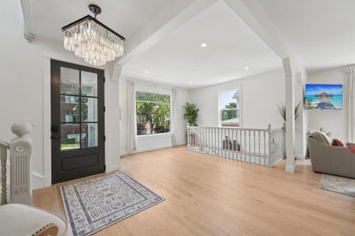 A welcoming entry framed by original windows and timeless detail.
