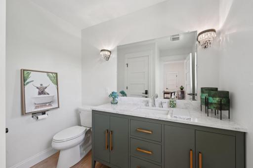 A thoughtfully placed, refined powder room just off the main living spaces.