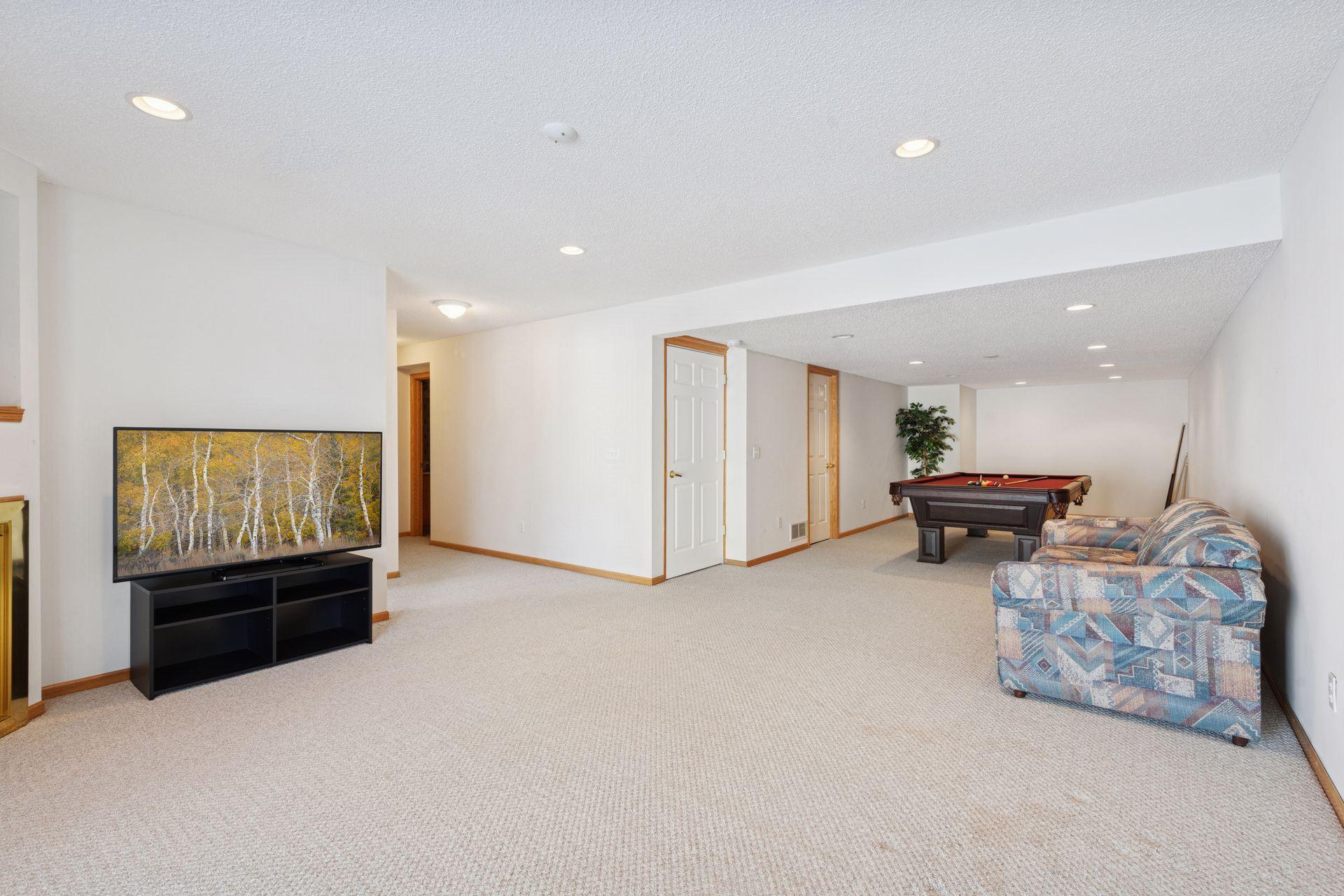 Terrific family room with second gas fireplace is open to amusement room