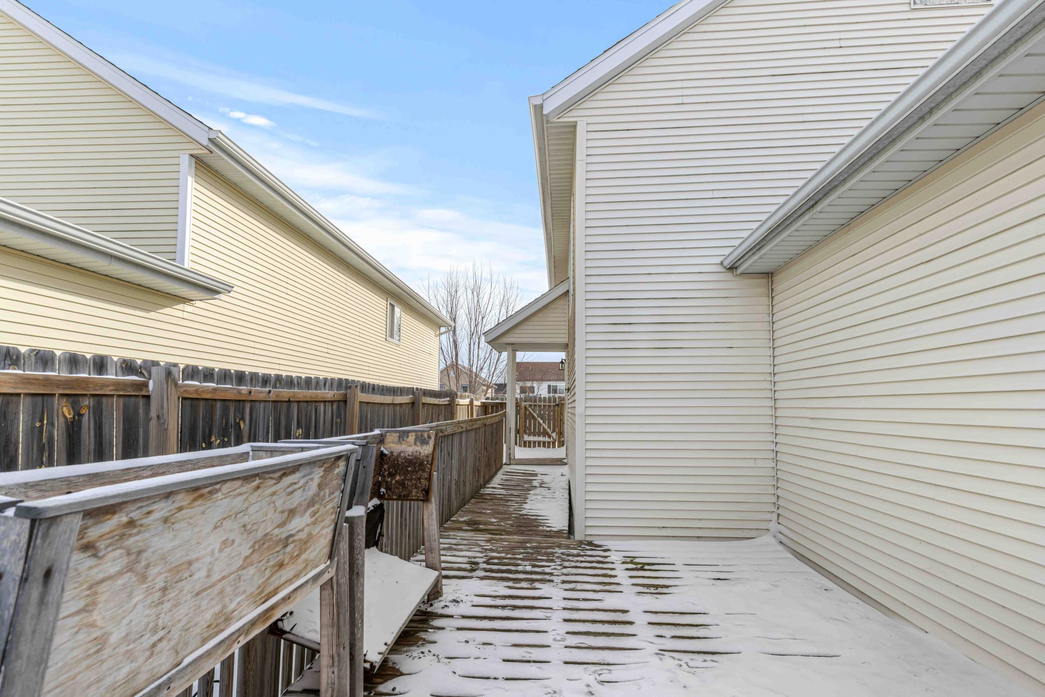 View from deck to side door of house.