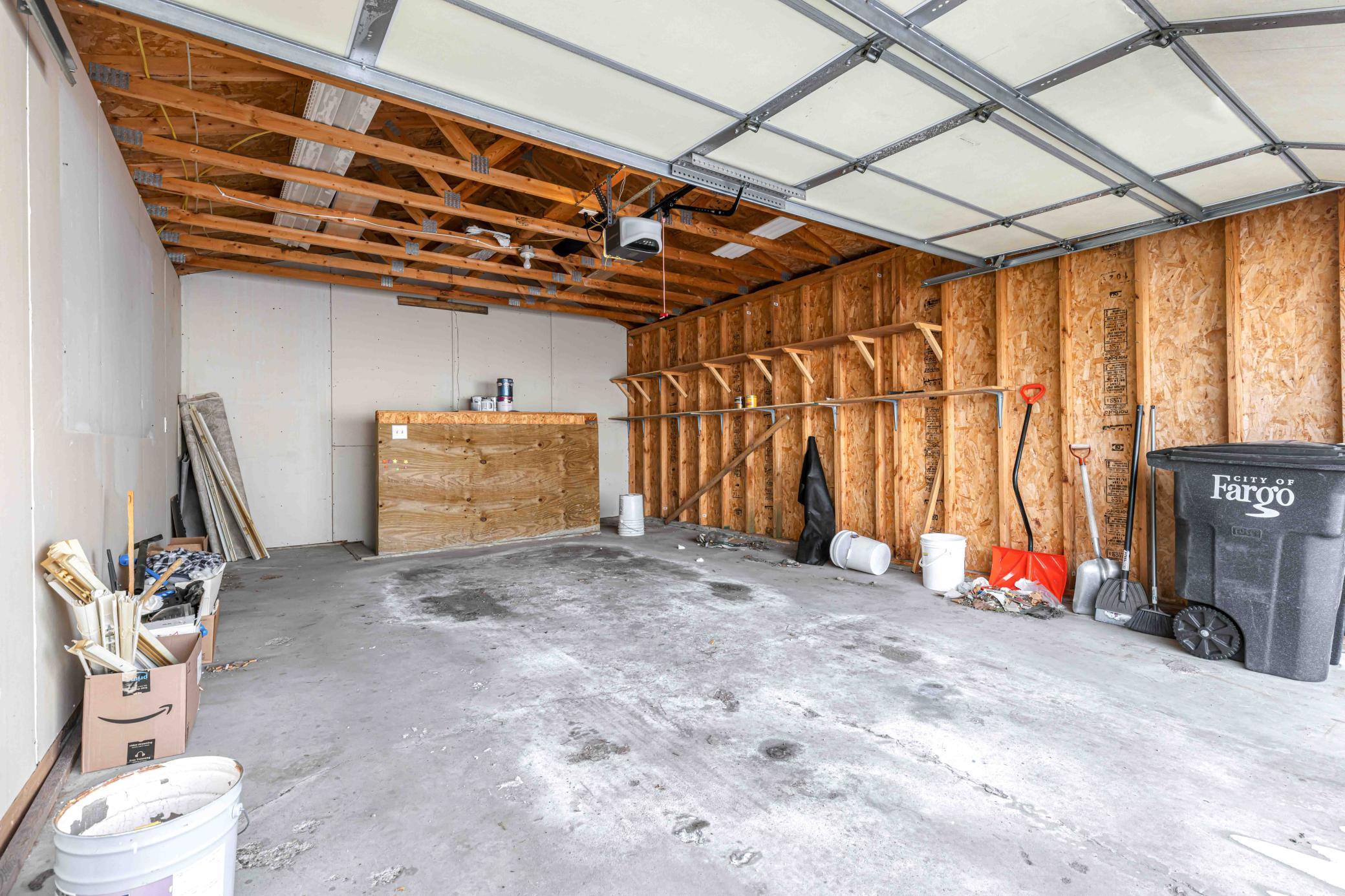 Garage wih steps to lower level into the house.