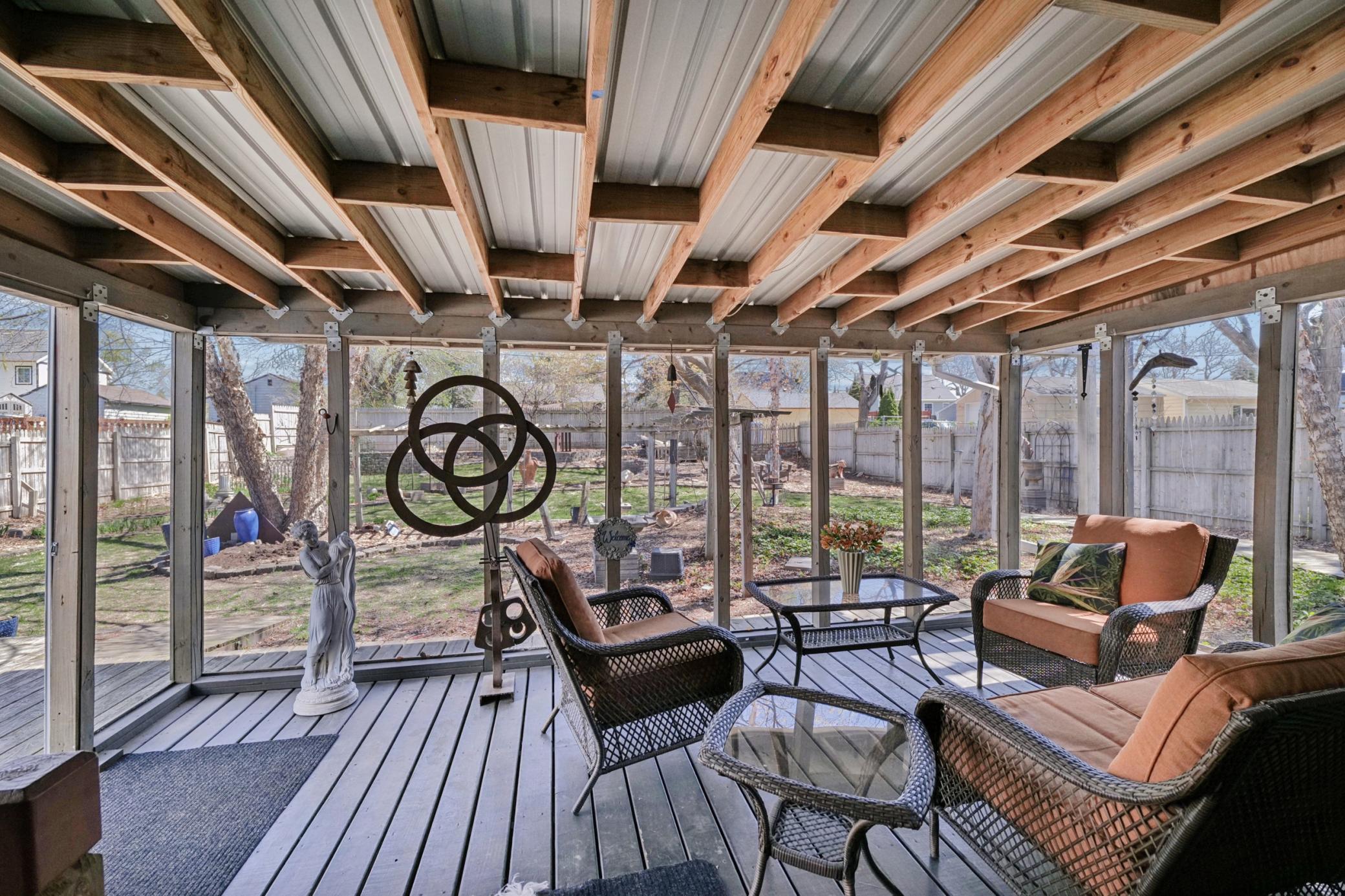 Screened in Porch overlooking the huge, amazing, backyard garden oasis.
