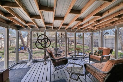 Screened in Porch overlooking the huge, amazing, backyard garden oasis.