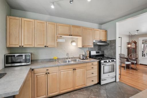 Heart of the Home, the kitchen boosts stainless steel appliances, heated stone floors, and garden window.
