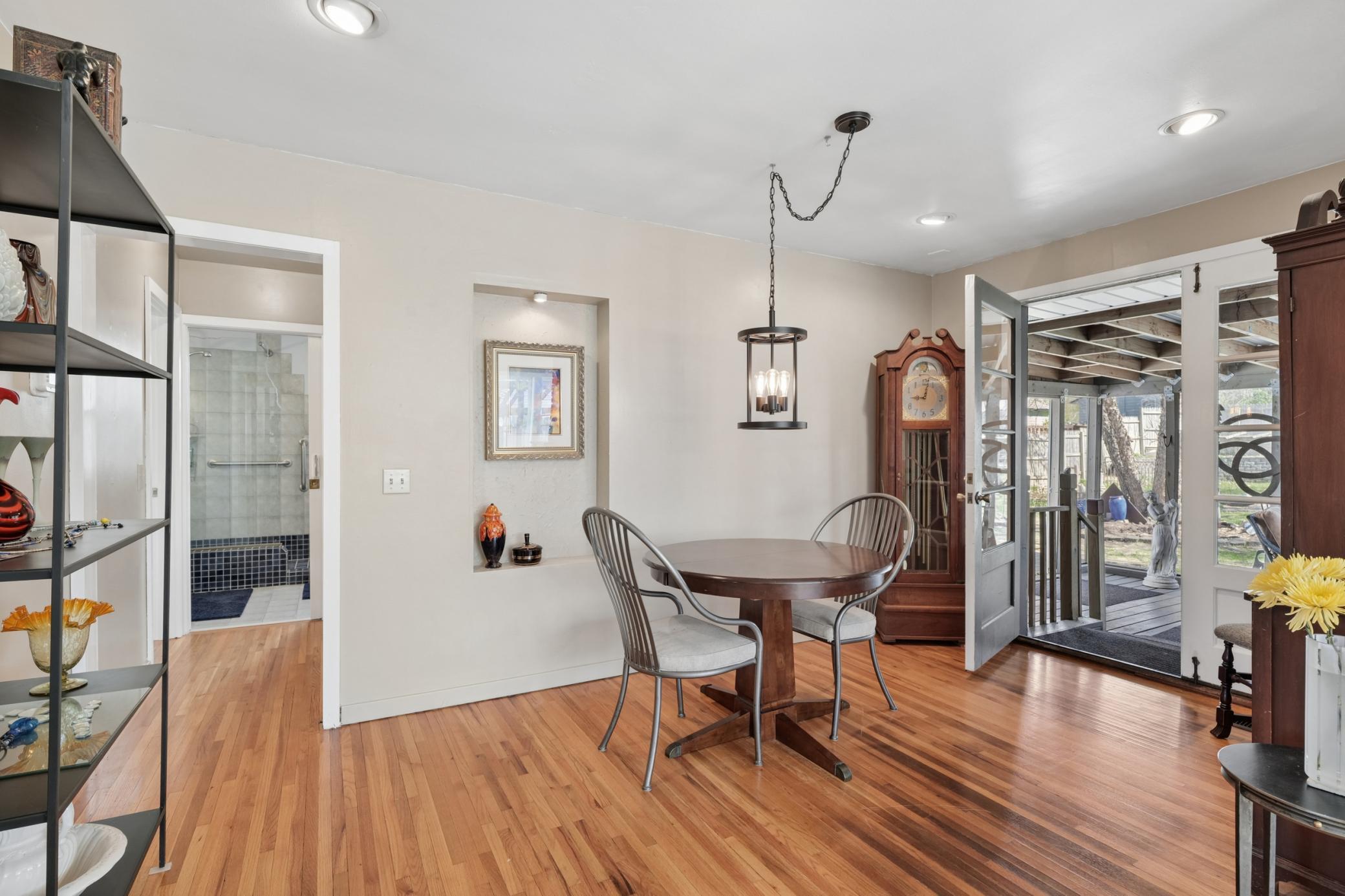 The dining area is the gathering place in the morning for inspiring conversation about the workday ahead. In the evening you converse about what you accomplished and the best part of your day. The back door leads out to an amazing screened in porch.