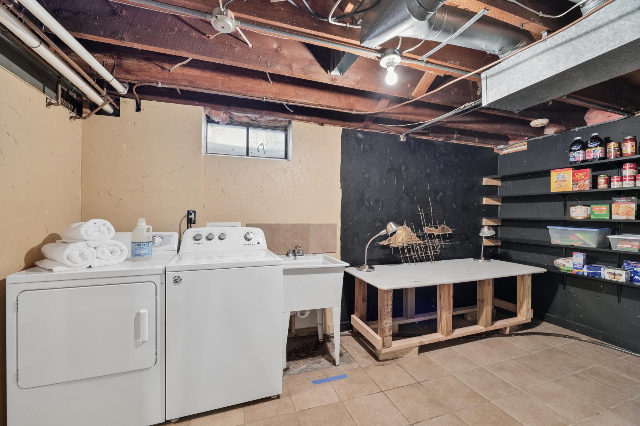 Lower-level laundry area, love folding a load of warm towels from the dryer. Pantry area, great space for all your canned and homemade goods.