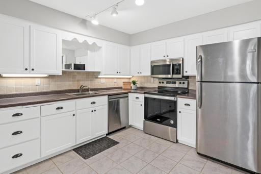Photo for 2200 Nevada Avenue S, 106, Minneapolis, MN 55426 - listing #7011367 UPDATED KITCHEN WITH NEW MICROWAVE IN 2025. DISHWASHER AND RANGE REPLACED IN 2021.