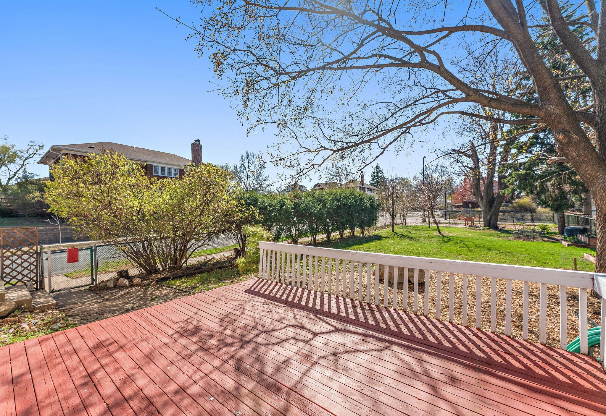 Deck overlooking the spacious yard - a gardener's dream!