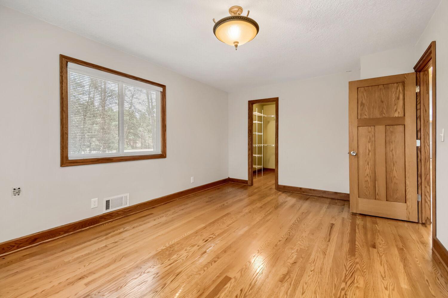 Owners bedroom with beautiful hardwood floors