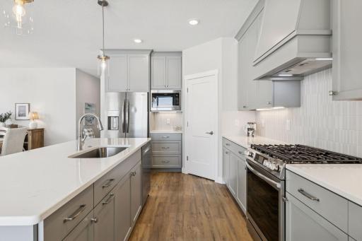 Stainless steel appliances and decorative subway tile backsplash