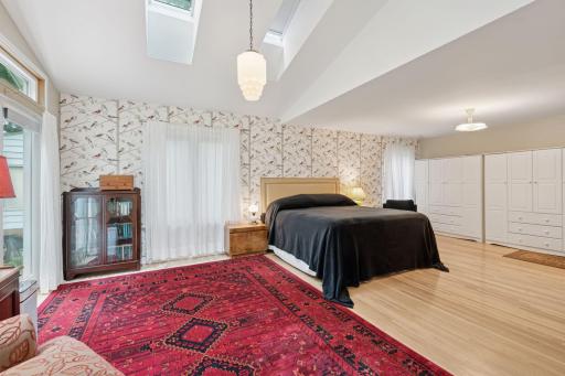 Primary suite with skylights and luxury bath and vaulted ceilings