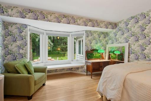 Bedroom #2 on main level with window seat and real hardwood floors