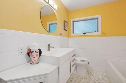 Renovated 2nd bath on main level - also with a roll in shower and separate tub