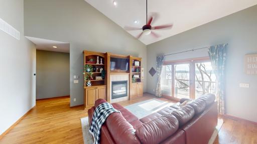 Living room w/vaulted ceilings and walkout to deck