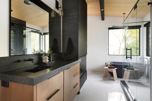 Primary en suite complete with tub, walk in shower, walk in closet and adjacent to the laundry room - previously built home