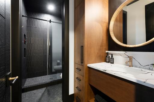3 en suite bathrooms in the lower level complete with a washer and dryer - previously built home