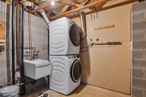 Lower level laundry area with new washer & dryer. This area also houses the radon mitigation system