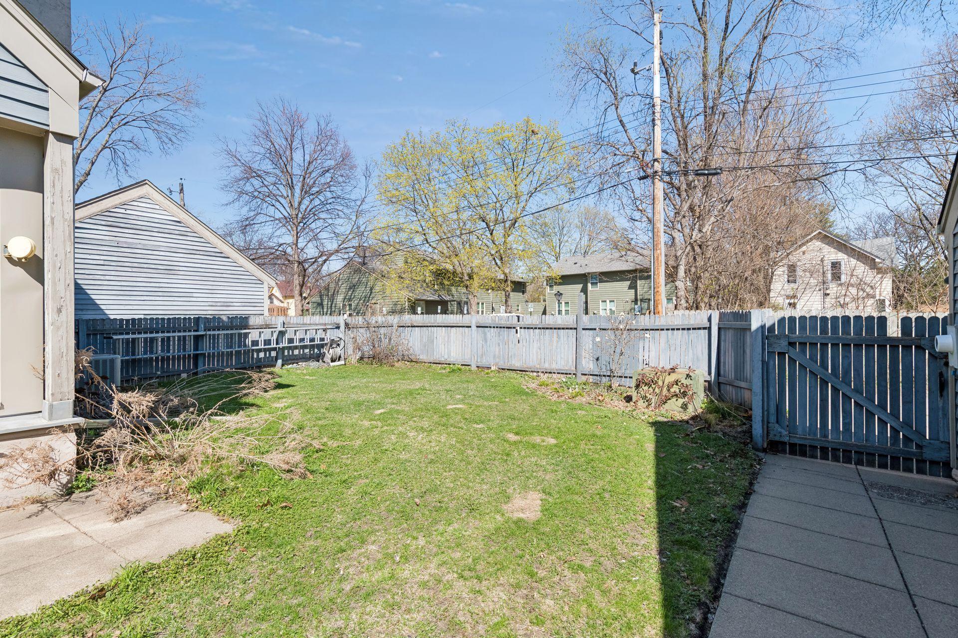 Shared yard space is partially fenced