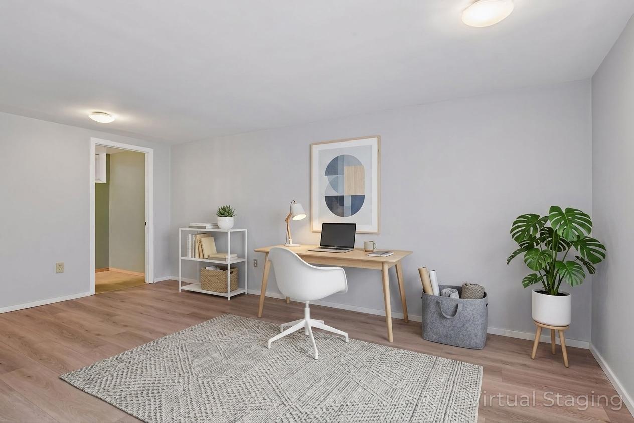 Updated lower level with new flooring and egress window. Could be used as an office, family room or additional bedroom - virtually staged