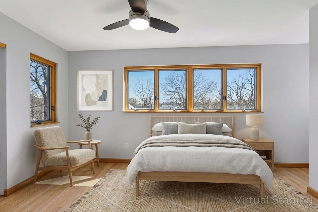 Upper level bedroom 1 with tons of natural light - virtually staged