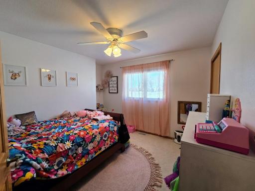 West bedroom is carpeted, closet & ceiling fan