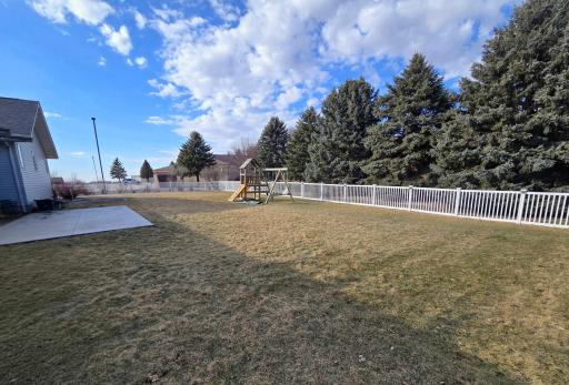 Back yard is fenced in with attractive composite fence