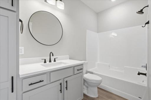 Full bathroom off the hallway with Quartz counter tops