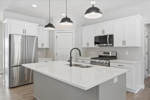 Large kitchen island with Quartz counter tops