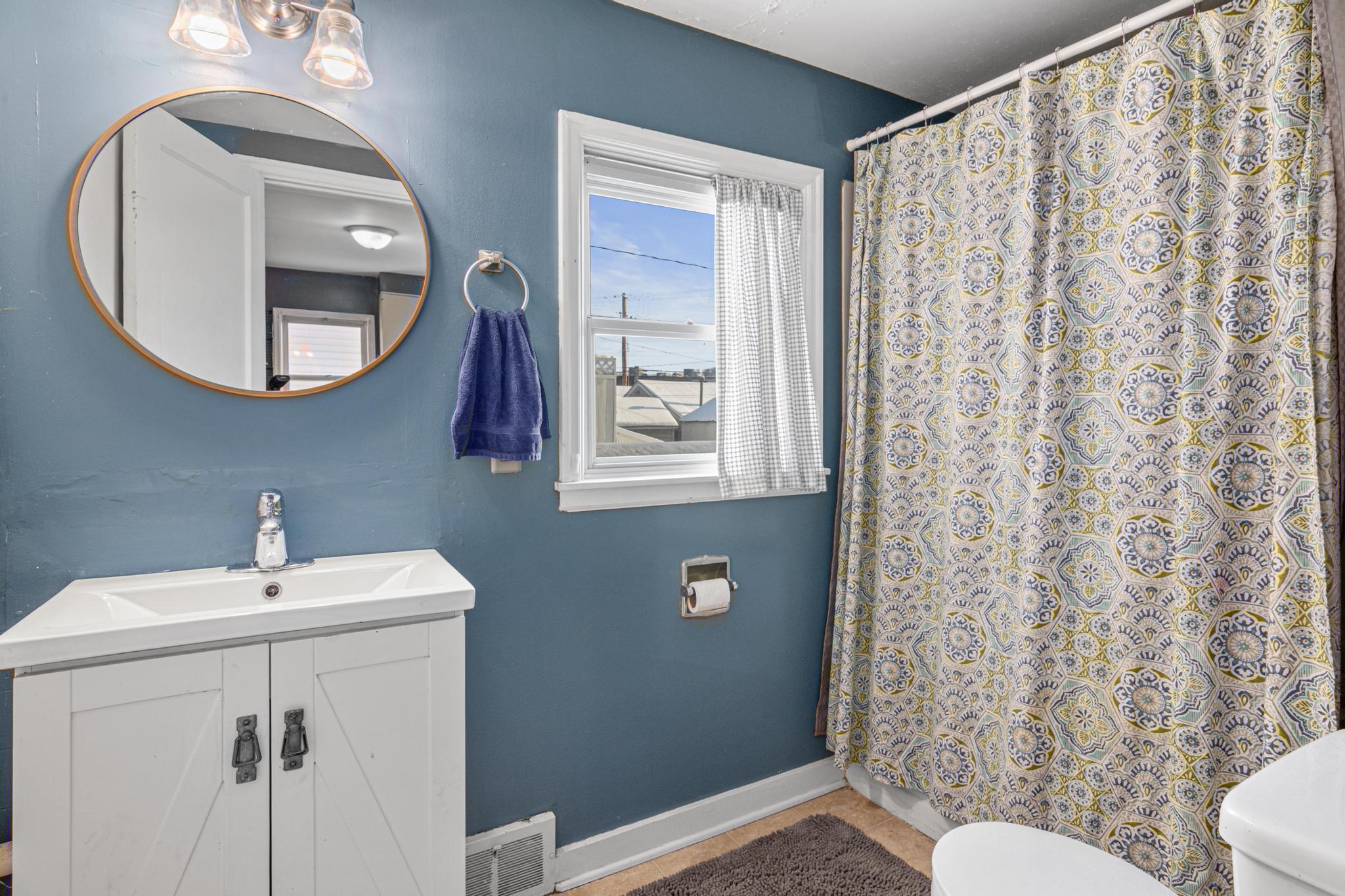 Main level half bath off kitchen.