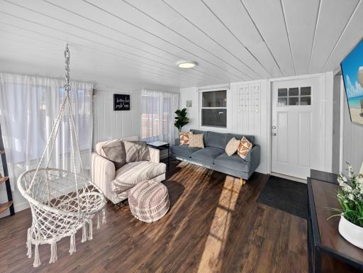 Sunroom connecting the kitchen to the fenced-in yard and the garage!