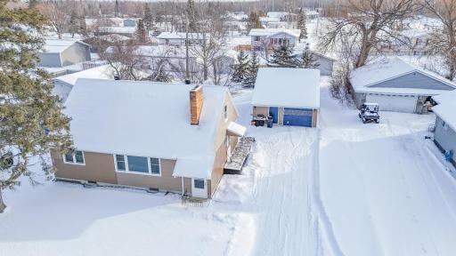 **Driveway & Garage View** – Long driveway leading to a detached garage, offering off-street parking and storage options.
