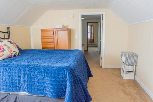 Additional angle showing floor space and access to the hallway.