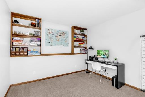 lower level family room has convenient built in shelves