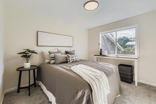 Main bedroom with soft natural light and calming neutral tones.