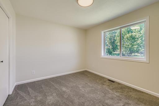 2nd Upstairs bedroom with backyard views.