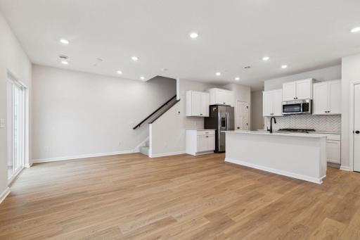 An open concept home, where the family room, kitchen and dining area flow together, makes everyday living easier and more connected.