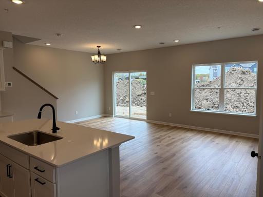 Welcome to your brand new home! The main entry of the Bayfield floorplan starts with a warm welcome to the kitchen and living room.