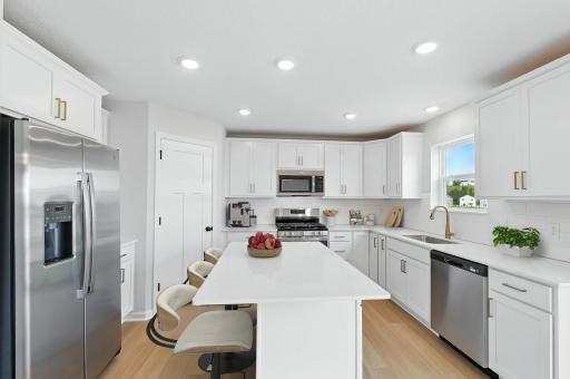 Introducing the Waterbury D Floorplan! Tastefully appointed kitchen w/ quartz countertops, soft close doors and drawers, & more! Photo of similar home for representation only. Colors and materials may vary in actual home.