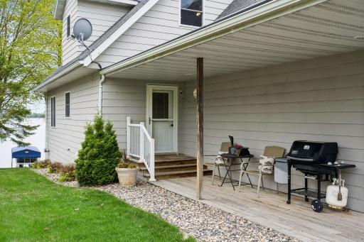 The welcoming covered front porch offers a quiet spot to relax after a fun day on the lake.
